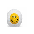 Golf ball with a smiley face design on a white background