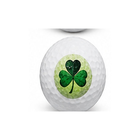 Golf ball with a green four-leaf clover design on a white background