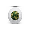 Golf ball with a camouflage pattern on a white background